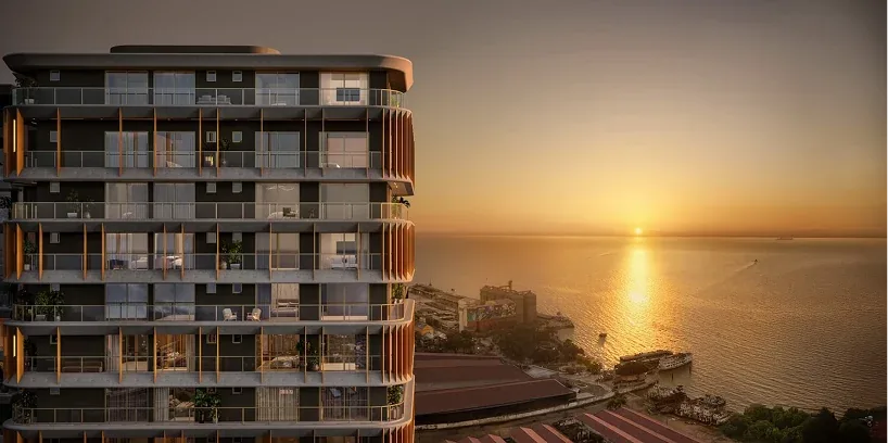 Edifício residencial em Belém com vista para a água ao pôr do sol